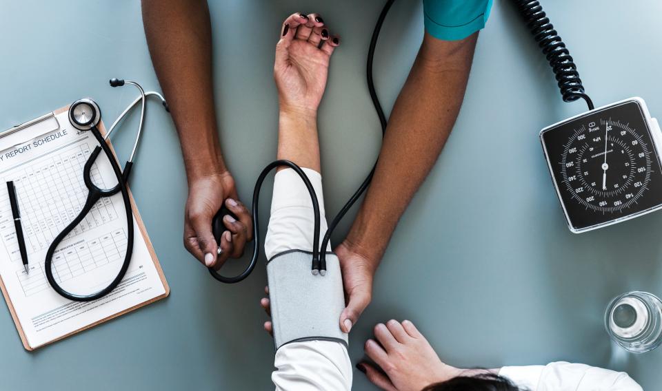 Doctor checking patient with stethoscope