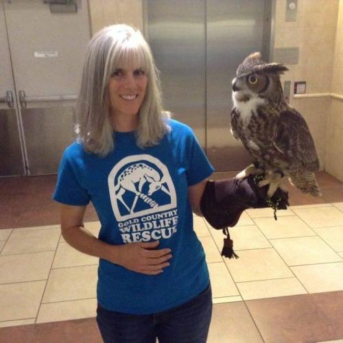 Photo of Shannon Wells holding an owl