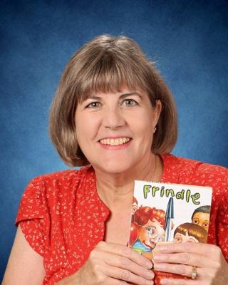 Portrait of Christina Bartell holding the book "Frindle"